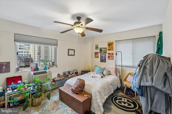 a bedroom with furniture and a potted plant