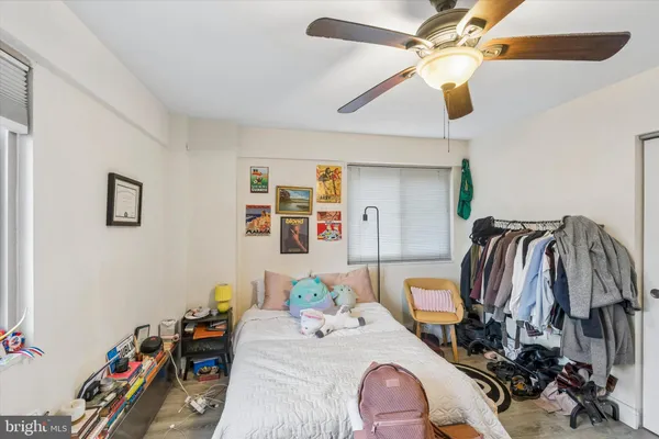 a bedroom with furniture and a chandelier