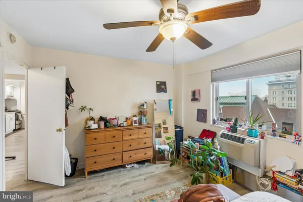 a bed room with a bed and a bookshelf