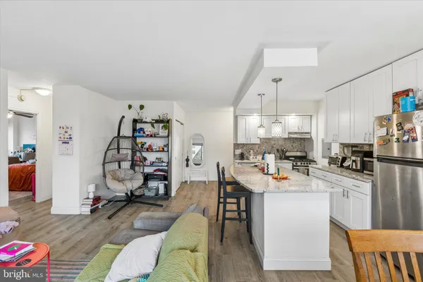 a view of a kitchen and dining room