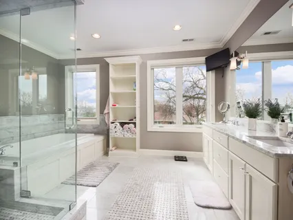 a bathroom with a bathtub and shower