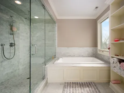 a bedroom with a bed wooden floor and window