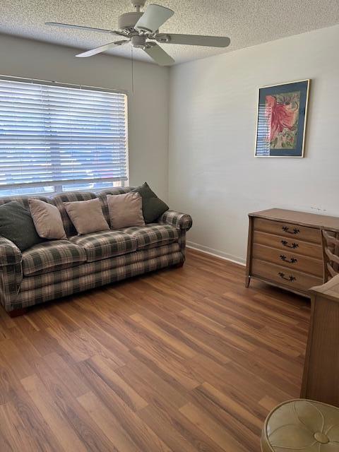 221 Lake Meryl Drive West Palm Beach, FL 33411 - Photo 12 of 31 a living room with furniture and a wooden floor