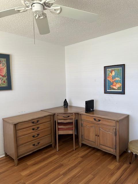 221 Lake Meryl Drive West Palm Beach, FL 33411 - Photo 13 of 31 a view of a workspace with furniture and wooden floor