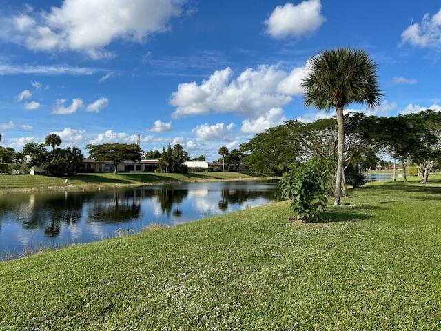 221 Lake Meryl Drive West Palm Beach, FL 33411 - Photo 2 of 31 a view of a lake with a yard