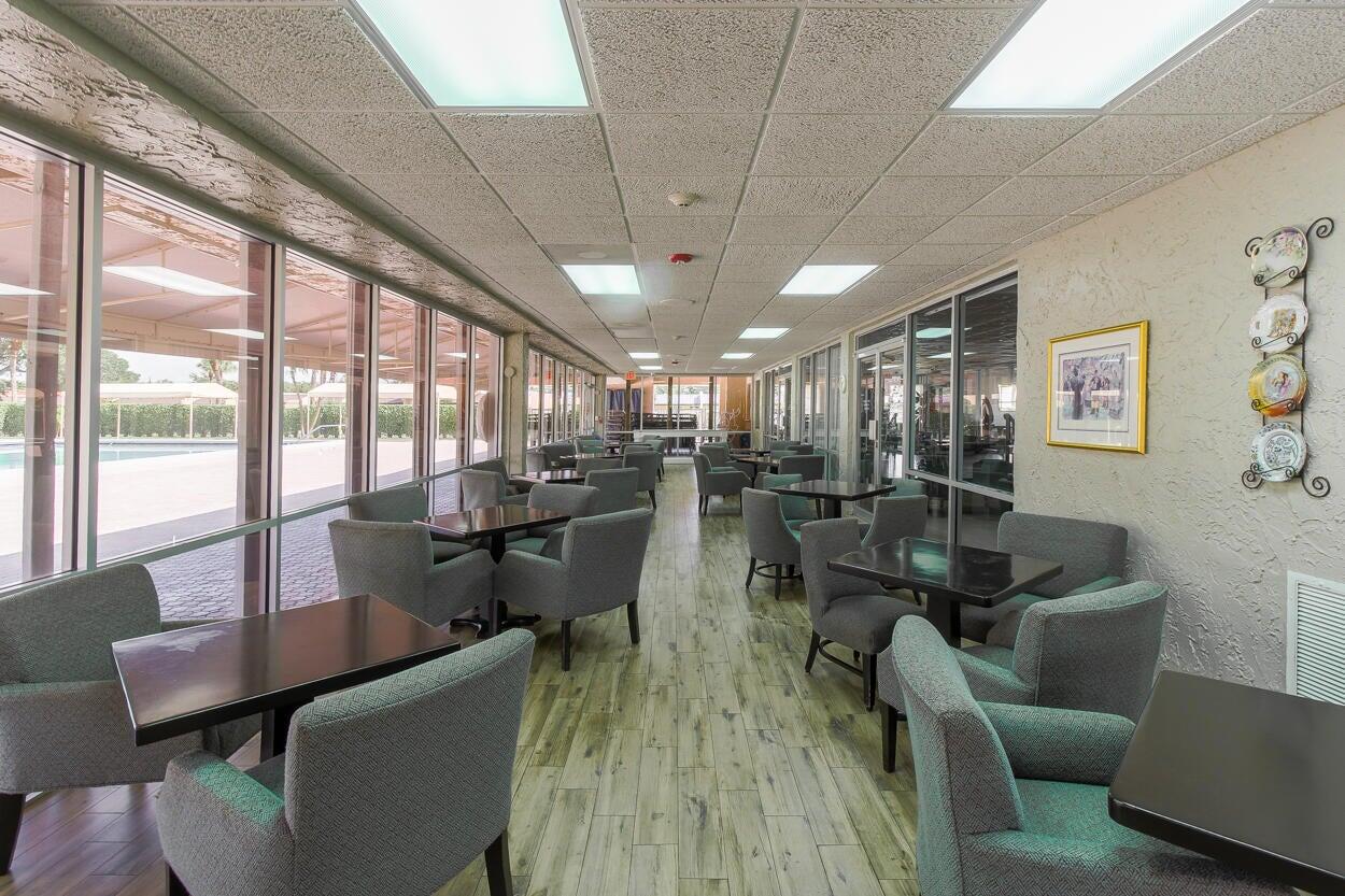 221 Lake Meryl Drive West Palm Beach, FL 33411 - Photo 25 of 31 a living room with lots of furniture and a large window