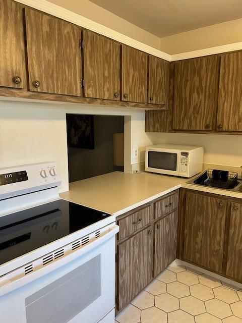 221 Lake Meryl Drive West Palm Beach, FL 33411 - Photo 4 of 31 a kitchen with a cabinets and stainless steel appliances