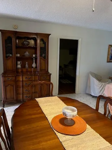 a bedroom with a bed and a mirror