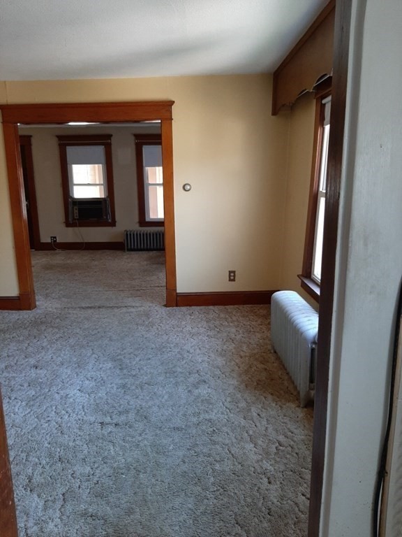 74 David Street Springfield, MA 01104 - Photo 3 of 12 a view of a livingroom with wooden floor and a bathroom