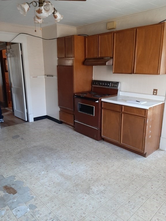 74 David Street Springfield, MA 01104 - Photo 6 of 12 a kitchen with stainless steel appliances granite countertop a refrigerator and a sink