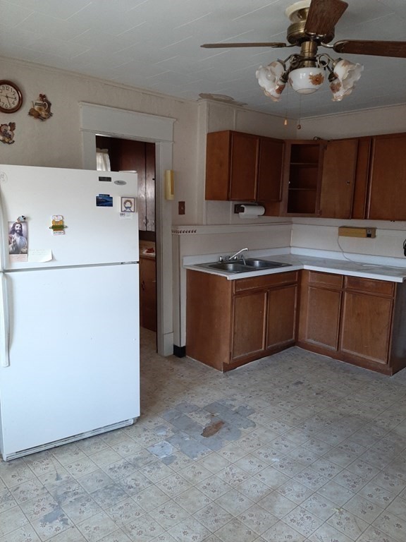 74 David Street Springfield, MA 01104 - Photo 9 of 12 a kitchen with a sink and refrigerator