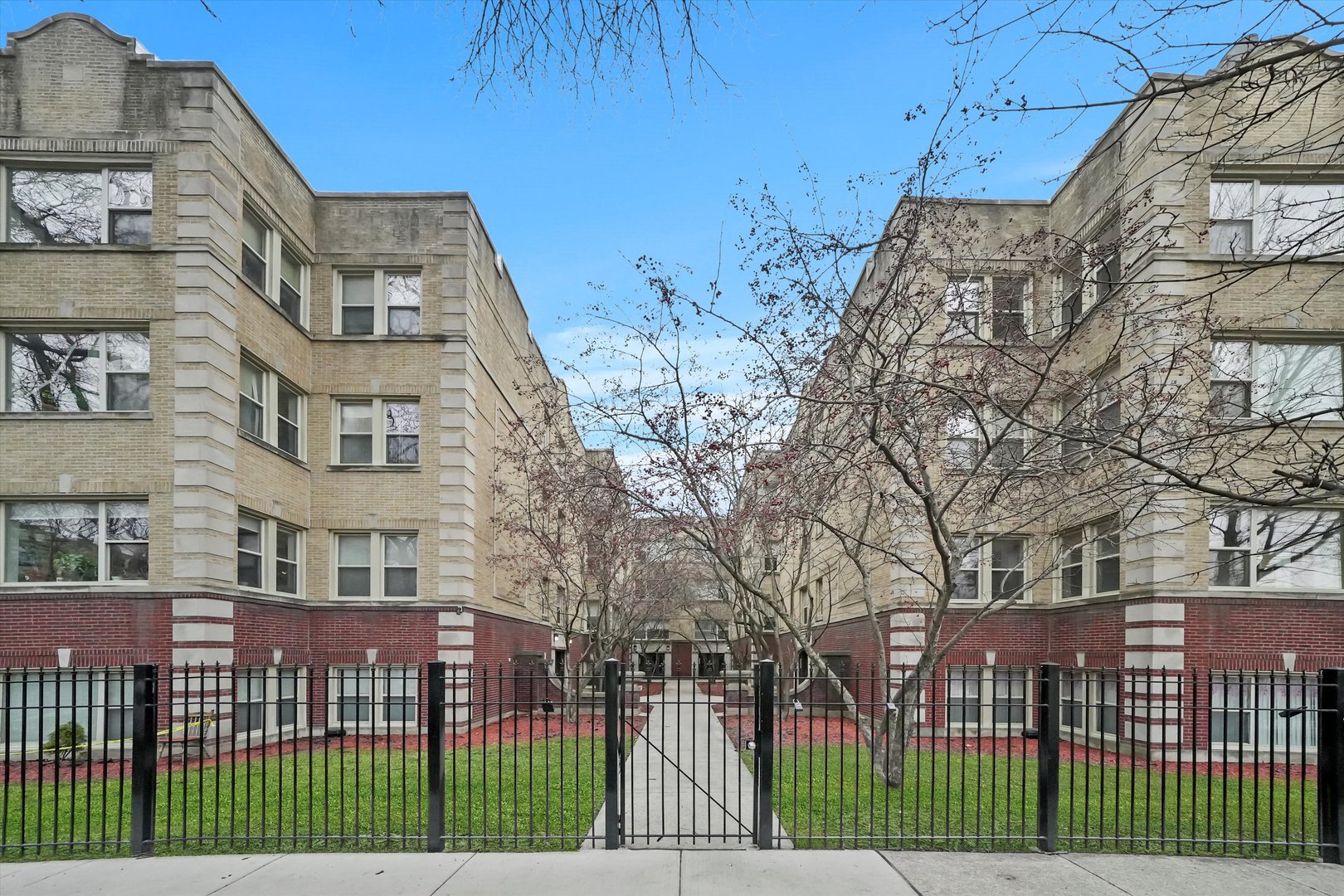 4845 North Harding Avenue, Unit 3 Chicago, IL 60625 - Photo 1 of 17 a front view of a house with a garden