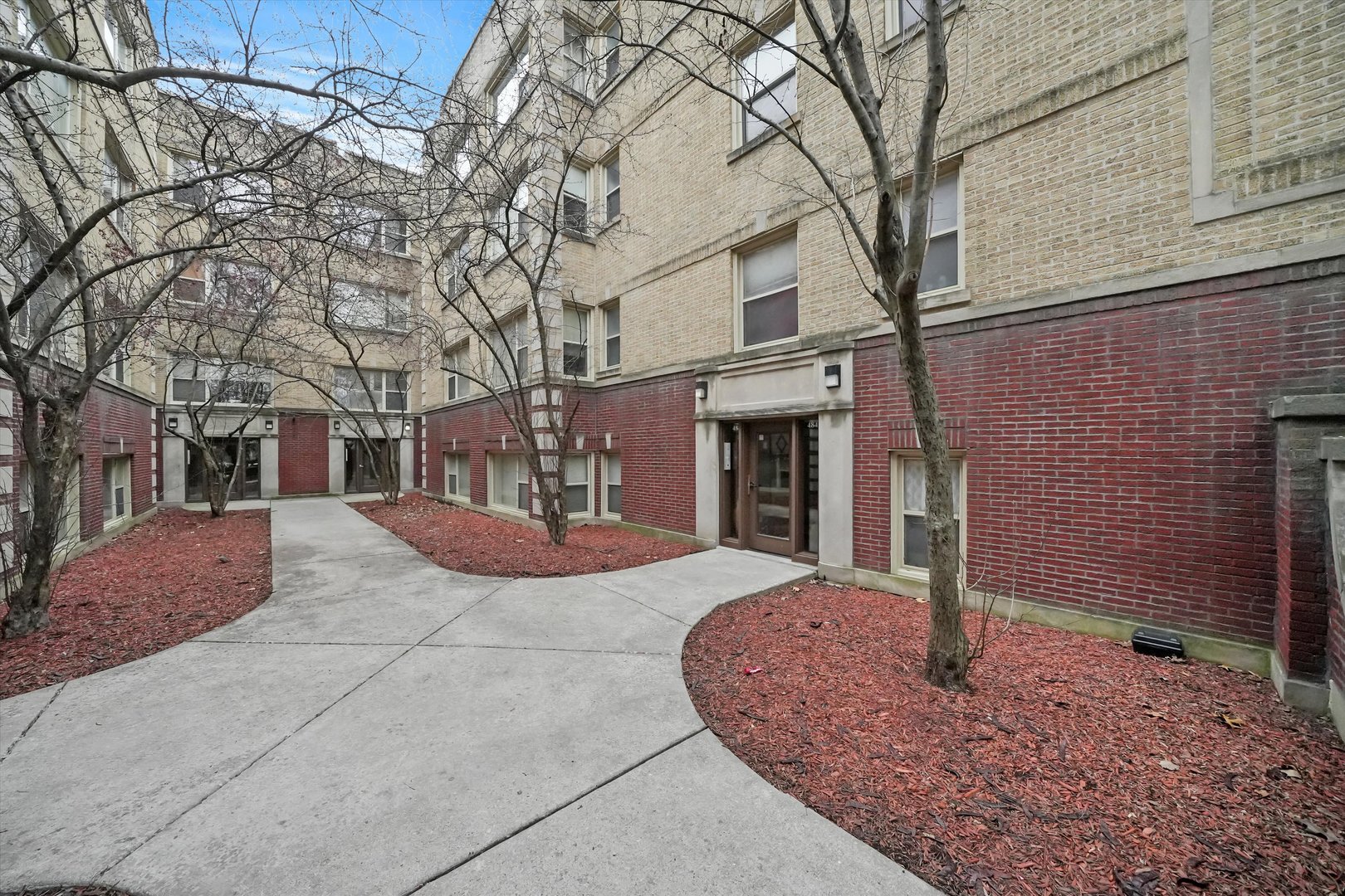 4845 North Harding Avenue, Unit 3 Chicago, IL 60625 - Photo 15 of 17 a view of a house with a yard and tree s