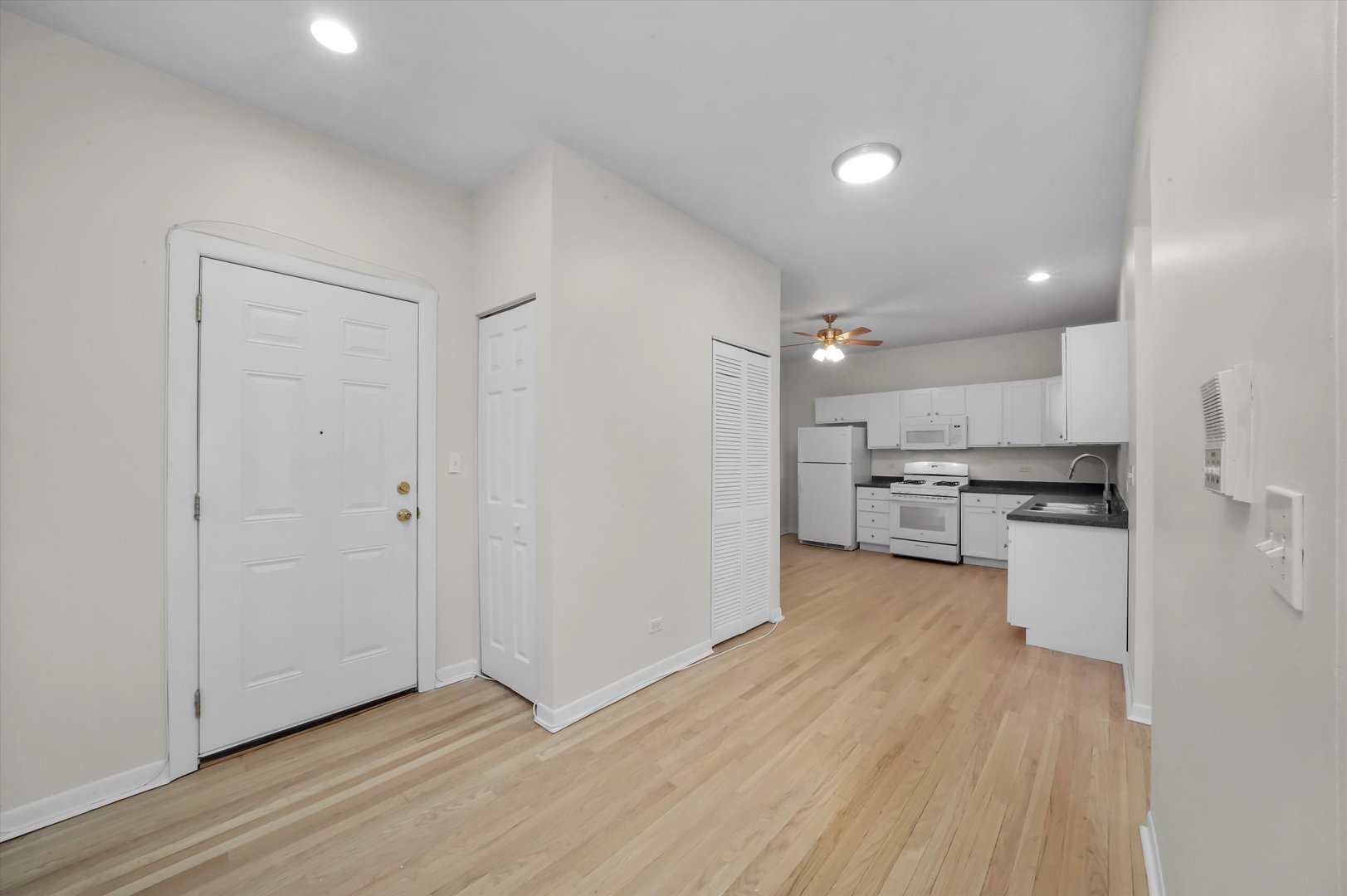 4845 North Harding Avenue, Unit 3 Chicago, IL 60625 - Photo 8 of 17 a view of kitchen with wooden floor