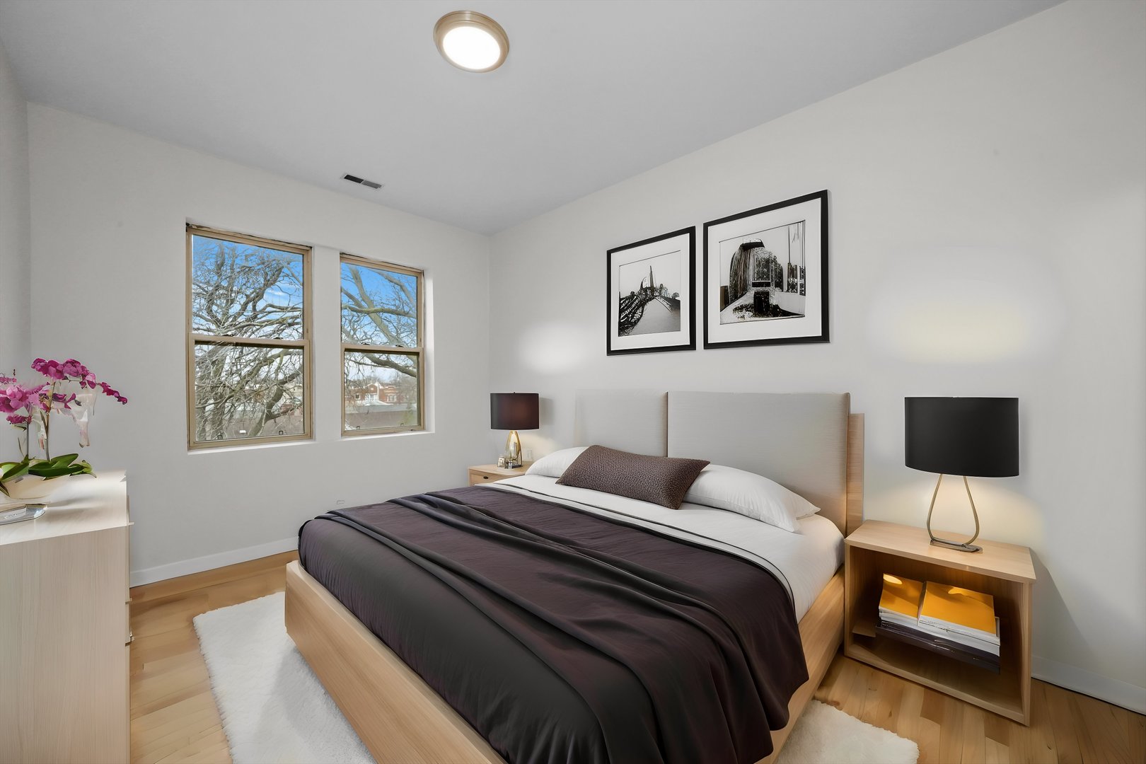 4845 North Harding Avenue, Unit 3 Chicago, IL 60625 - Photo 10 of 17 a bedroom with a bed and a window