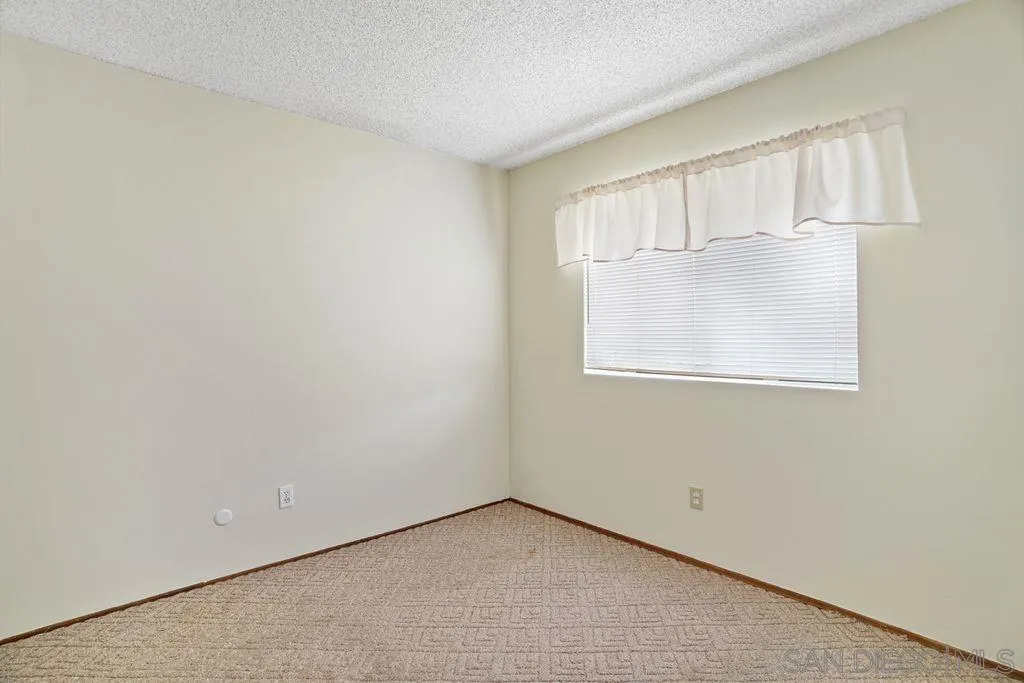 750 Kostner Drive San Diego, CA 92154 - Photo 13 of 34 an empty room with windows