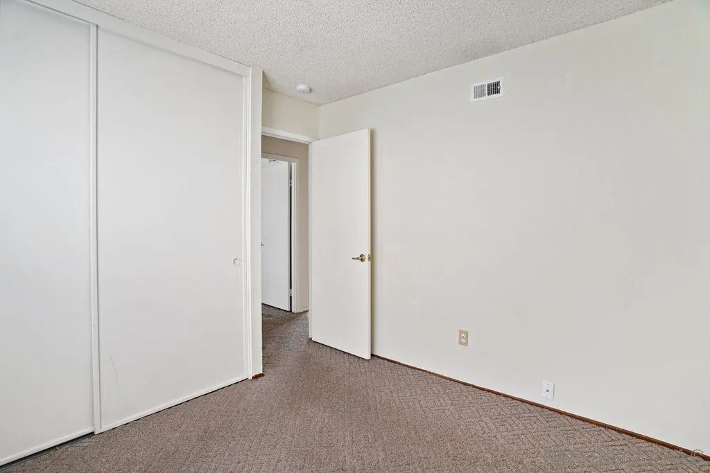 750 Kostner Drive San Diego, CA 92154 - Photo 14 of 34 a view of hallway with rug