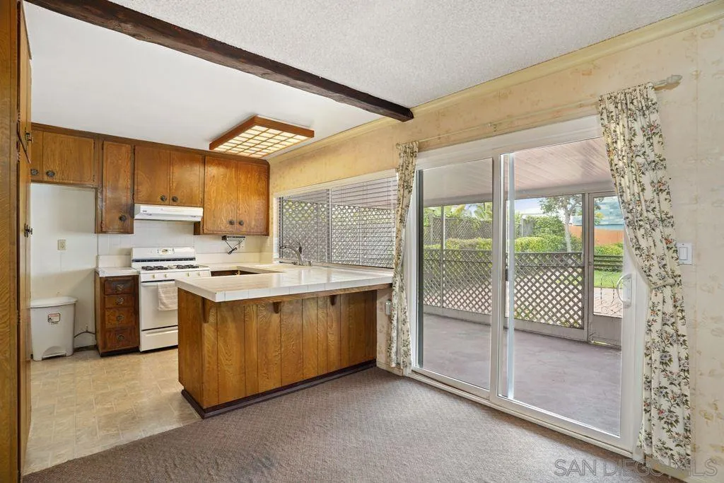 750 Kostner Drive San Diego, CA 92154 - Photo 15 of 34 a kitchen with stainless steel appliances granite countertop a stove a sink and a refrigerator
