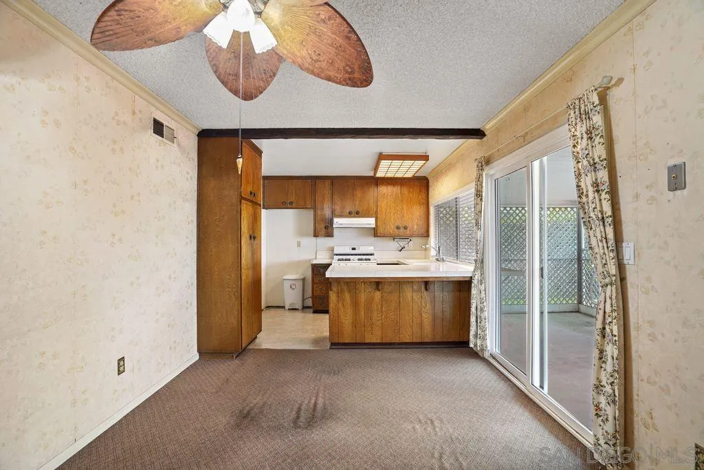 750 Kostner Drive San Diego, CA 92154 - Photo 16 of 34 a kitchen with a sink and a refrigerator
