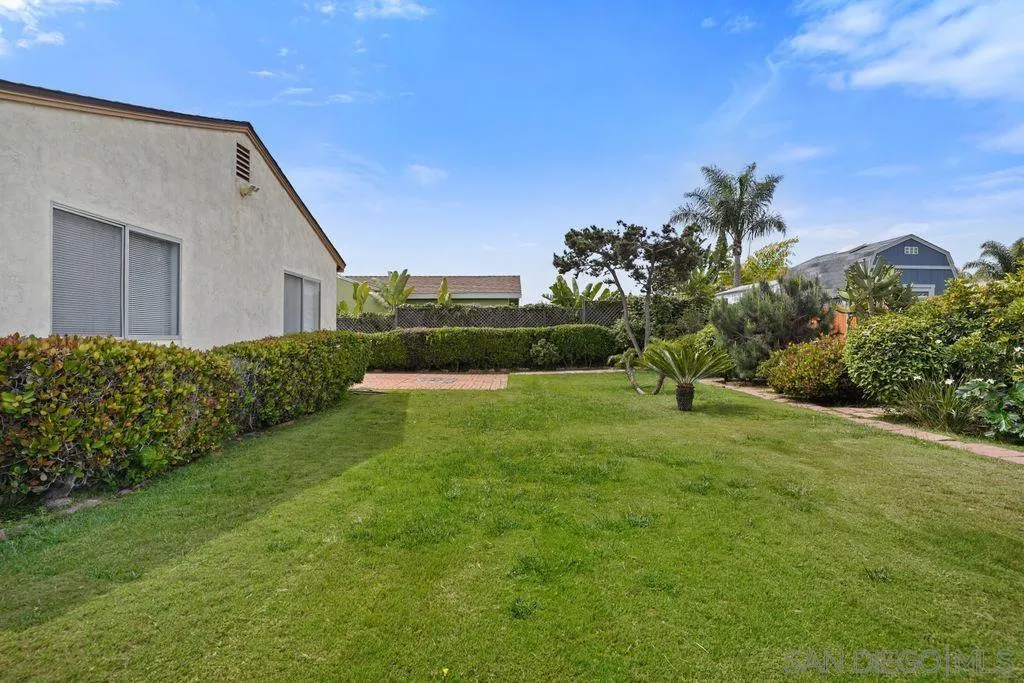 750 Kostner Drive San Diego, CA 92154 - Photo 26 of 34 a view of a backyard with plants and a garden