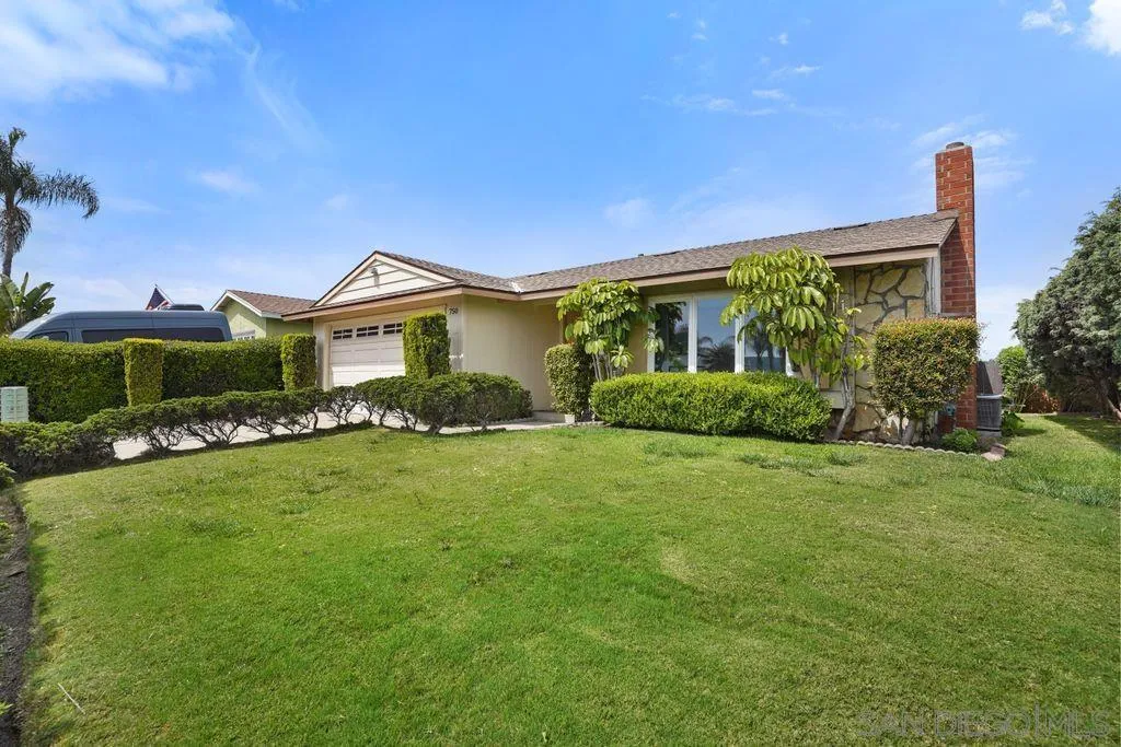 750 Kostner Drive San Diego, CA 92154 - Photo 32 of 34 a front view of a house with a garden
