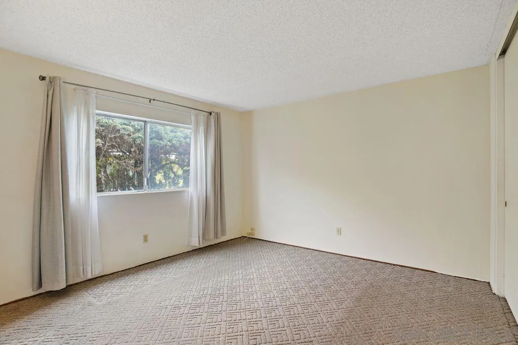 750 Kostner Drive San Diego, CA 92154 - Photo 6 of 34 a view of an empty room with a window