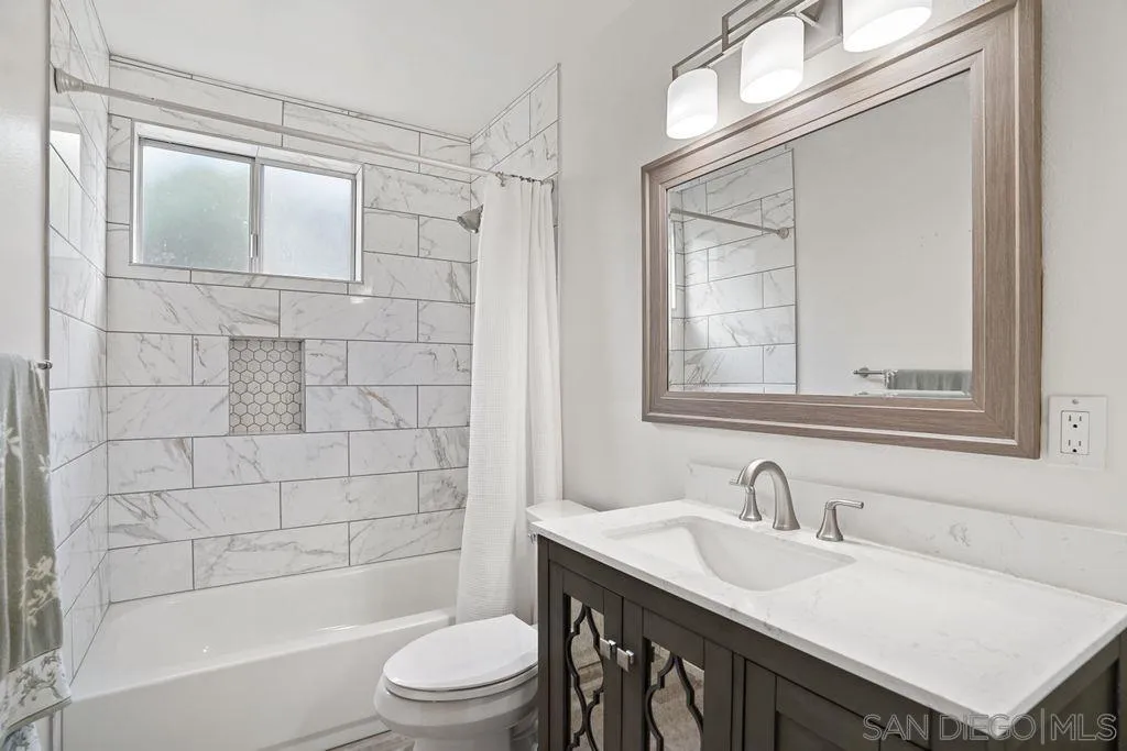 750 Kostner Drive San Diego, CA 92154 - Photo 10 of 34 a bathroom with a sink a toilet and shower