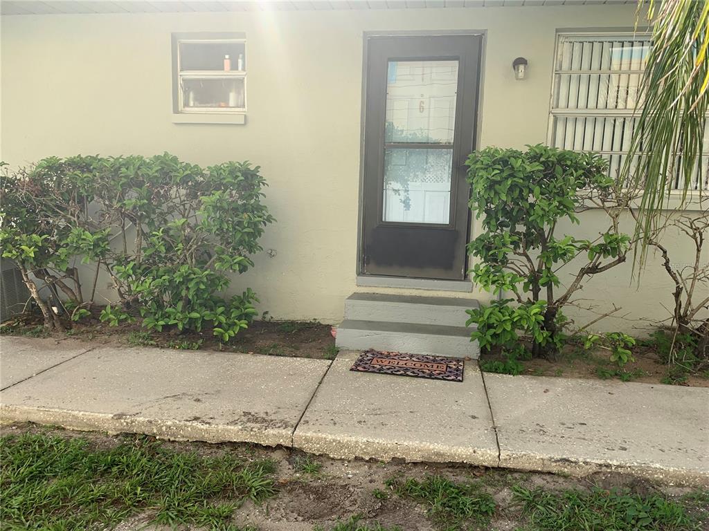 1021 Apollo Beach Boulevard, Unit 6 Apollo Beach, FL 33572 - Photo 1 of 1 a front view of a house with a yard