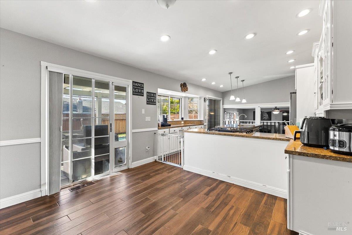 4457 Graywhaler Lane Rohnert Park, CA 94928 - Photo 16 of 51 a kitchen with stainless steel appliances a refrigerator and a wooden floor