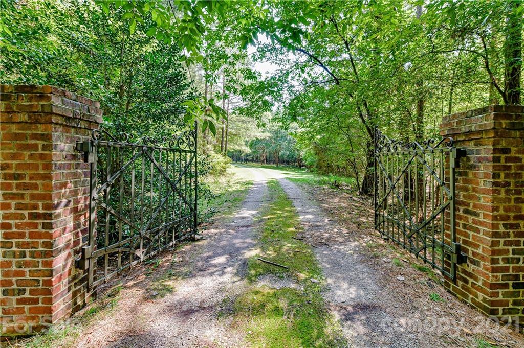 2539 Wooten Road Chester, SC 29706 - Photo 2 of 46 a view of a yard with plants and large trees