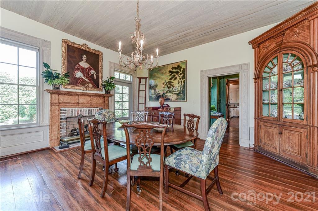 2539 Wooten Road Chester, SC 29706 - Photo 11 of 46 a view of a dining room with furniture a chandelier and wooden floor