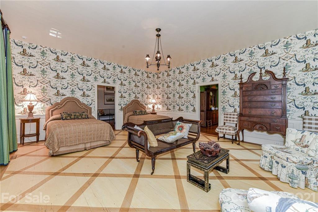 2539 Wooten Road Chester, SC 29706 - Photo 20 of 46 a living room with a fireplace and a chandelier