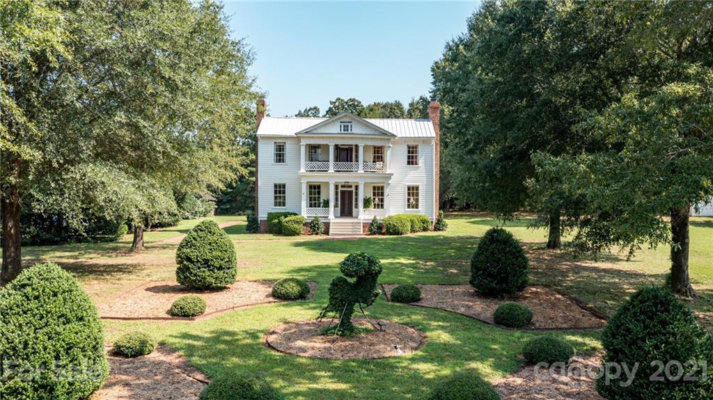 2539 Wooten Road Chester, SC 29706 - Photo 3 of 46 a front view of a house with garden and trees