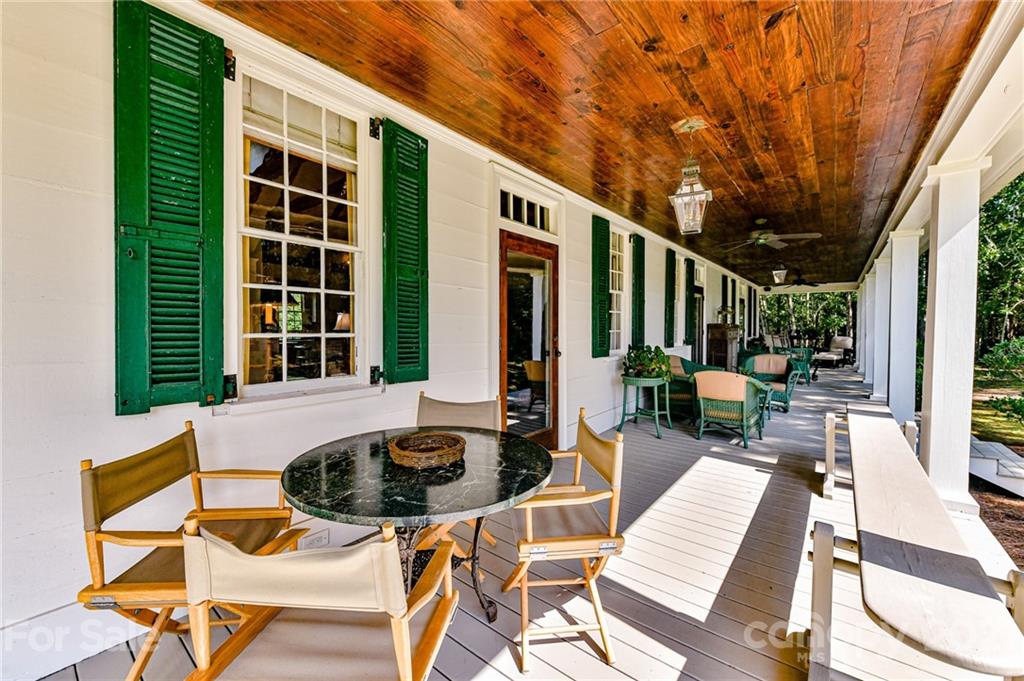 2539 Wooten Road Chester, SC 29706 - Photo 36 of 46 a view of a patio with table and chairs with wooden floor and fence