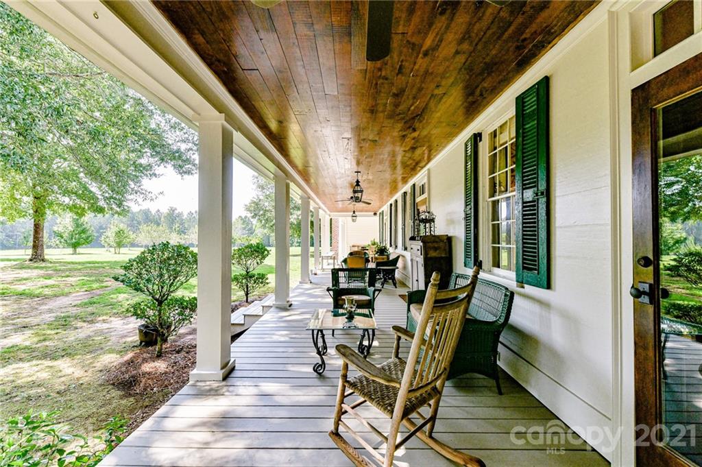 2539 Wooten Road Chester, SC 29706 - Photo 37 of 46 a view of a patio with table and chairs and wooden floor