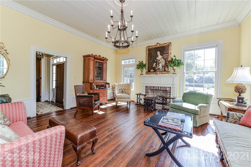 2539 Wooten Road Chester, SC 29706 - Photo 9 of 46 a living room with fireplace furniture and a chandelier