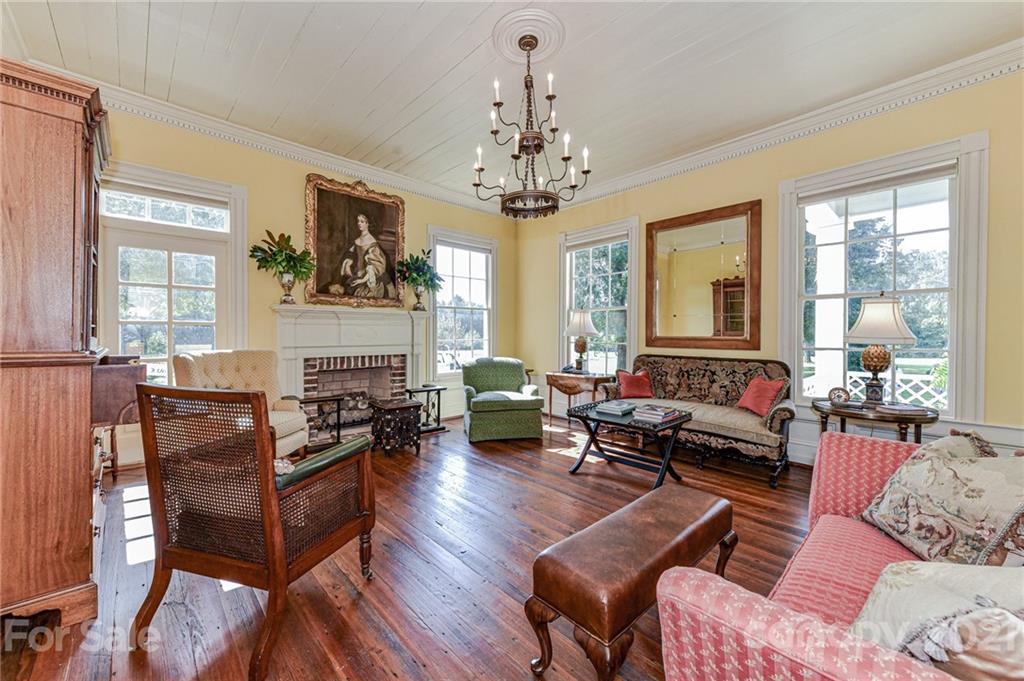 2539 Wooten Road Chester, SC 29706 - Photo 10 of 46 a living room with furniture chandelier and a fireplace