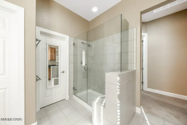 a bathroom with a shower and a sink