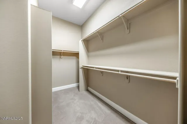 a view of an empty walk in closet