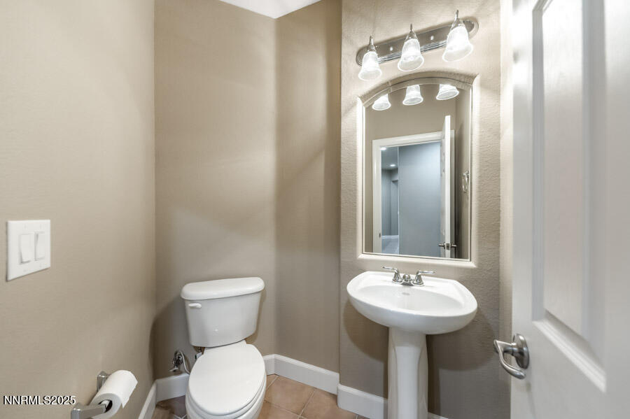 3240 Quartzite Drive Reno, NV 89523 - Photo 23 of 45 a bathroom with a toilet sink and mirror
