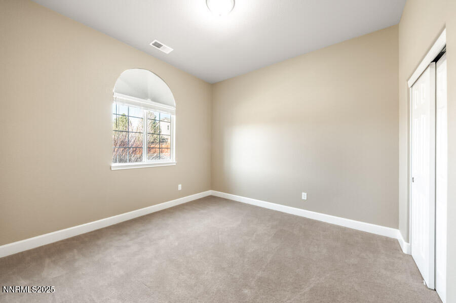 3240 Quartzite Drive Reno, NV 89523 - Photo 25 of 45 an empty room with windows and closet