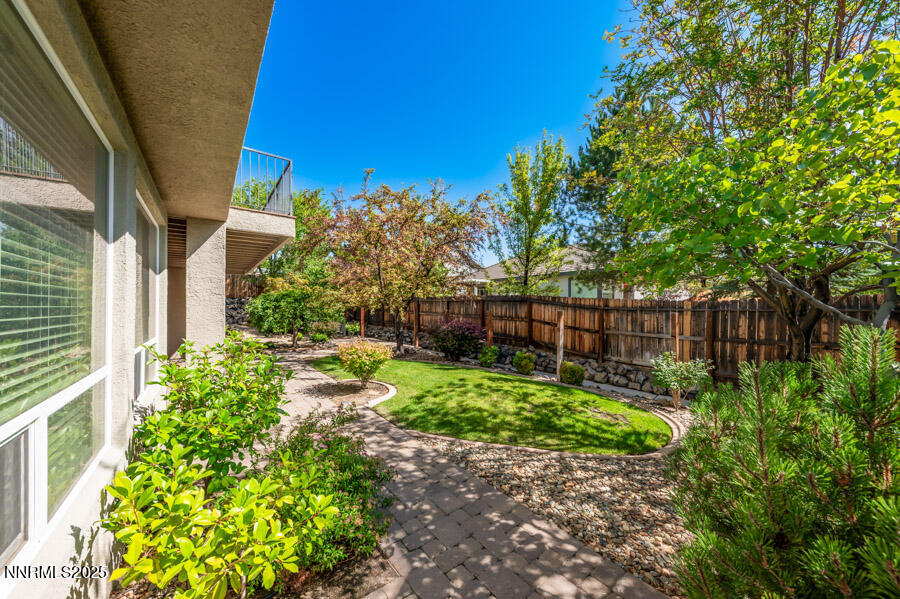 3240 Quartzite Drive Reno, NV 89523 - Photo 39 of 45 a view of a backyard with plants and large trees