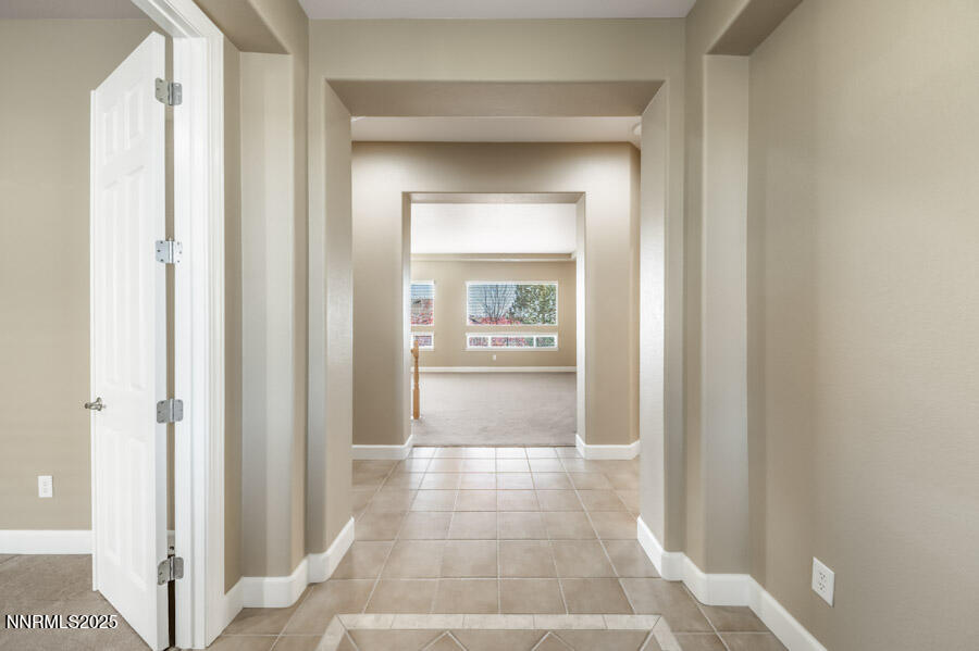 3240 Quartzite Drive Reno, NV 89523 - Photo 4 of 45 a view of a hallway with a glass door and a window