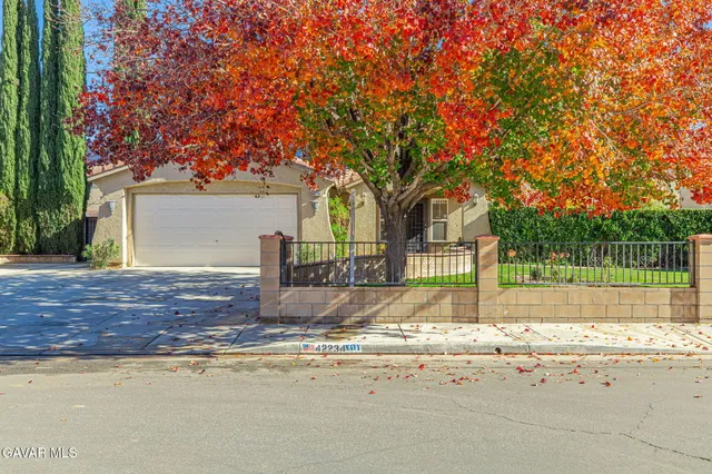 a view of a car park in front of a house