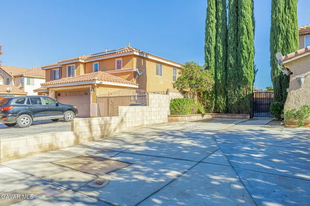 a view of a living room a window and wooden floor