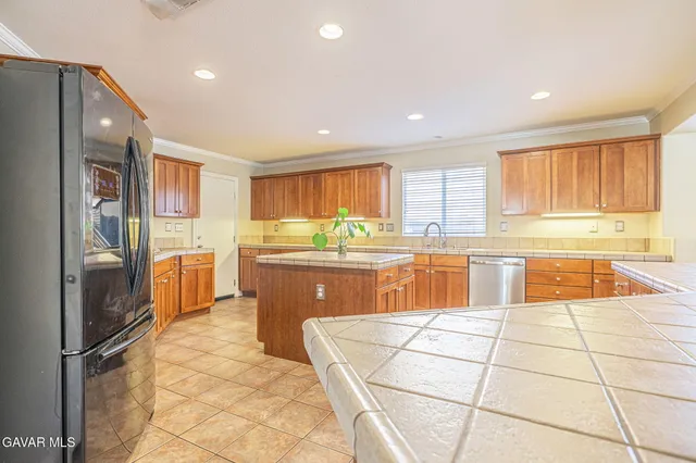 a bathroom with a granite countertop sink mirror vanity and toilet