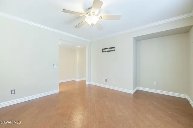 a spacious bedroom with a bed and a couch