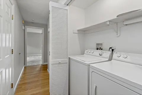 a view of an empty room and closet area