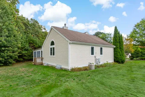 a view of a big room with an empty room and large windows