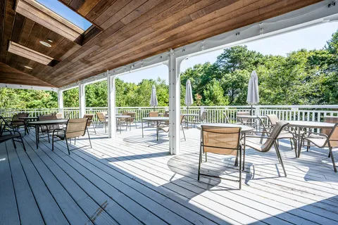 a view of a chairs and table on the wooden floor